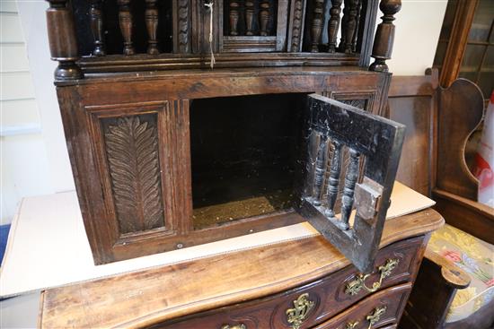 A 17th century oak glass or trencher case, W.2ft 9in. D.1ft 1in. H.2ft 5in.